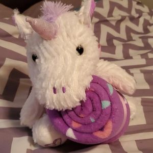 Plush white unicorn with blanket